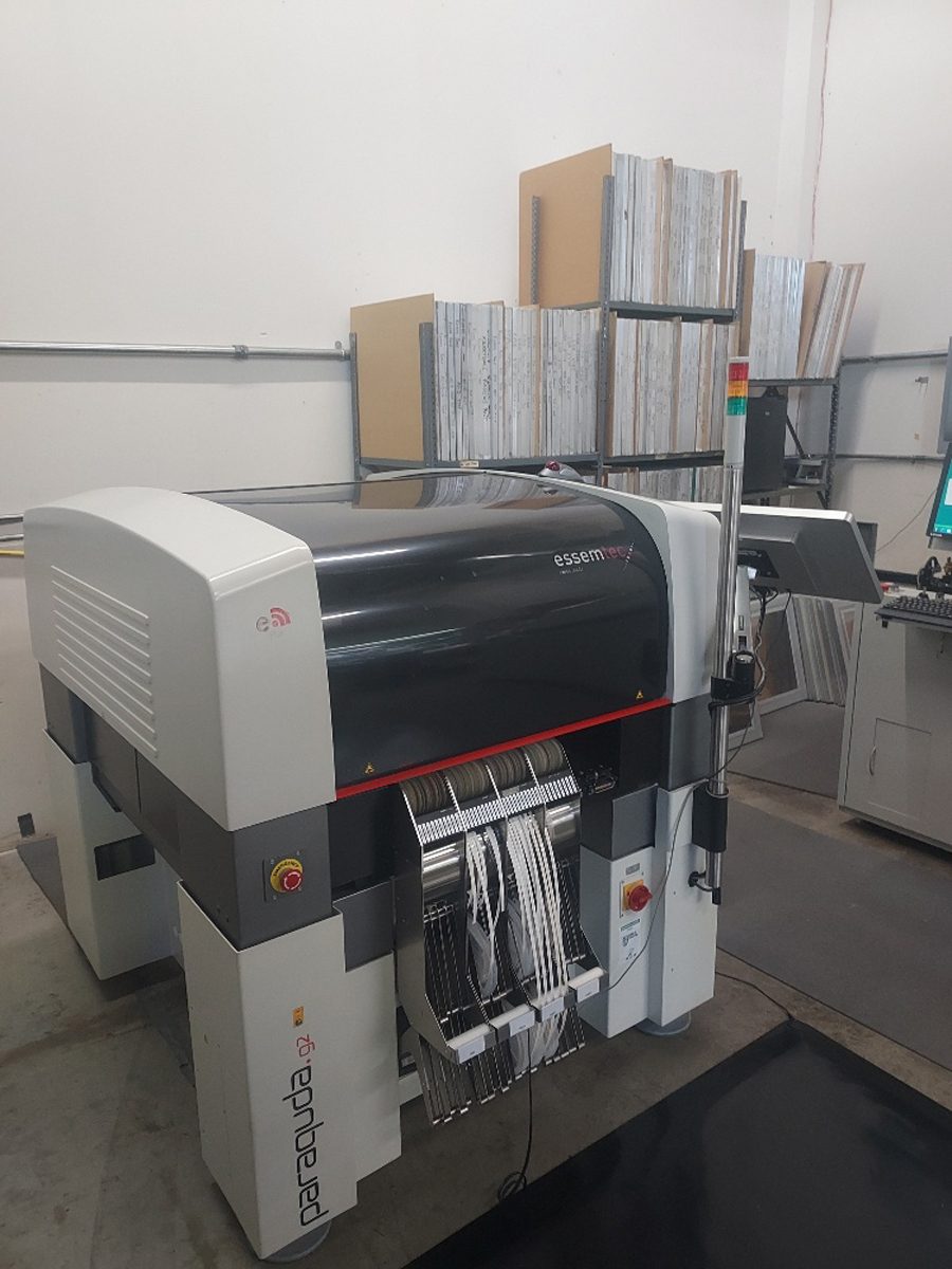An Essemtec Paraquda pick-and-place machine with component tape feeders loaded for a surface-mount production run.